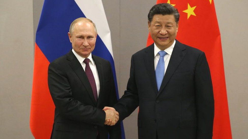 Russian President Vladimir Putin (L) with Chinese President Xi Jinping. 