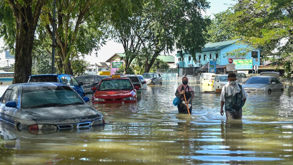 More than 60,000 flood victims across Malaysia have been evacuated from their homes.